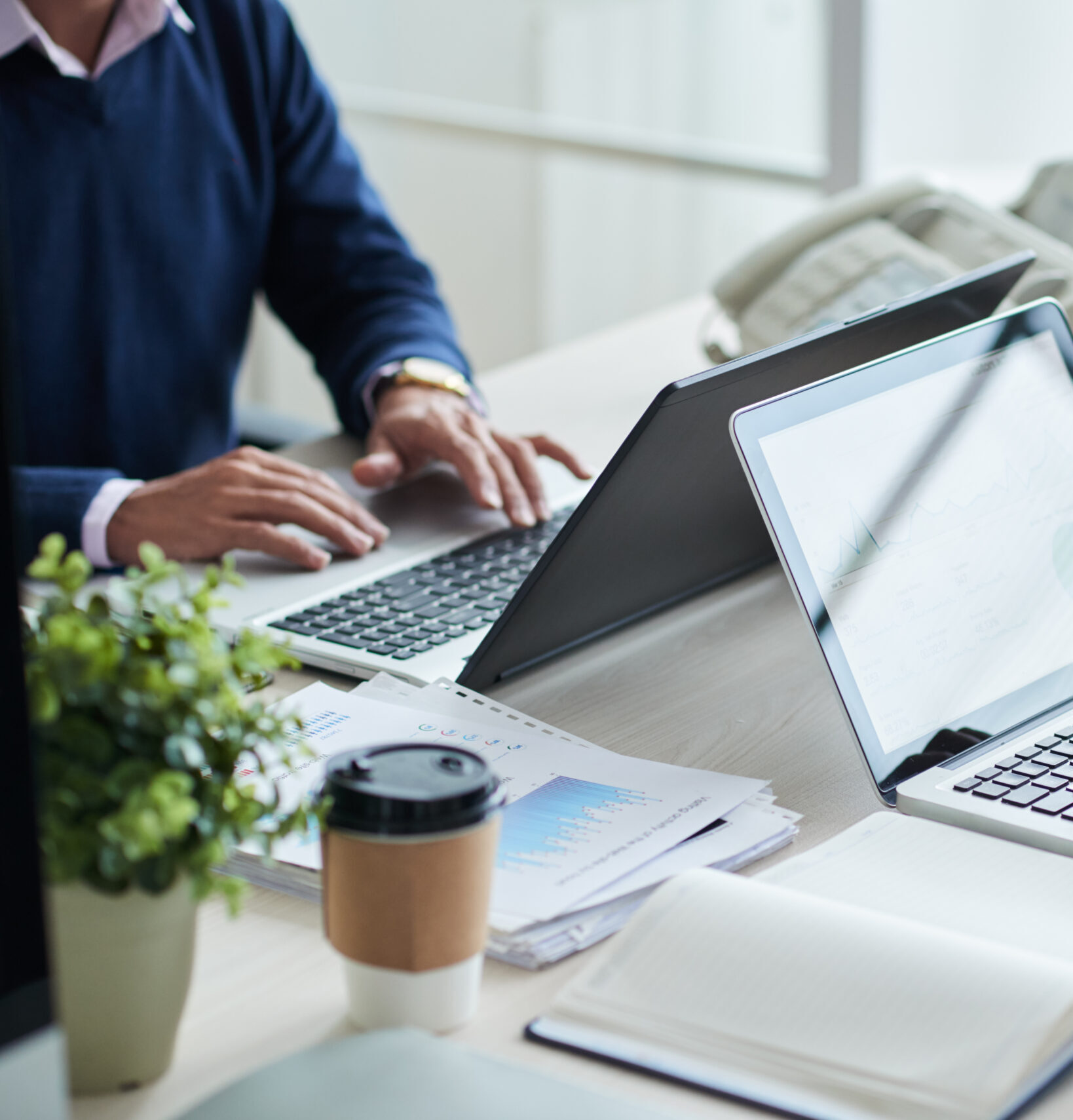 side view cropped unrecognizable business people working common desk scaled e1753387762192